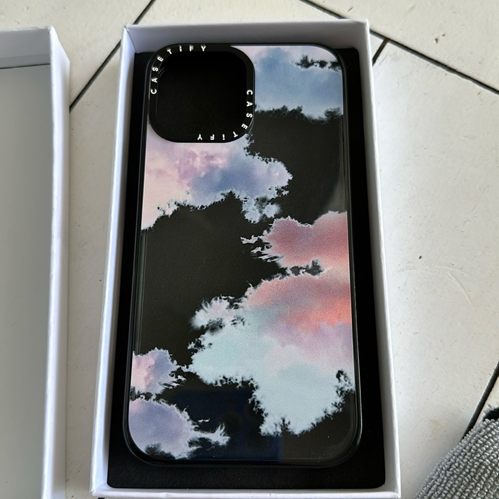Gently used Casetify iPhone 13 ProMax clouds clear black